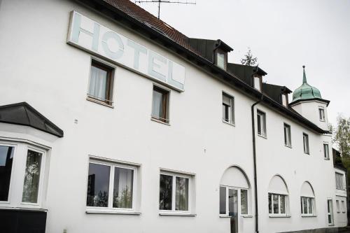 a white building with the word loz on it at Hotel Waldlust B&B in Schwandorf in Bayern