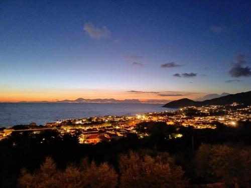 a view of a city at night at Dimora Acqua del Fico in Castellabate