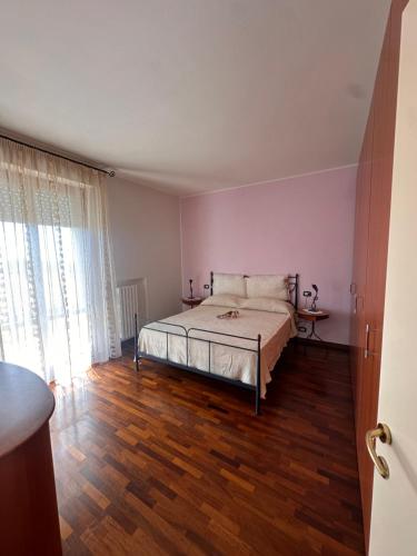 Postel nebo postele na pokoji v ubytování La Genesa - Le Grotte Rooms And Apartments