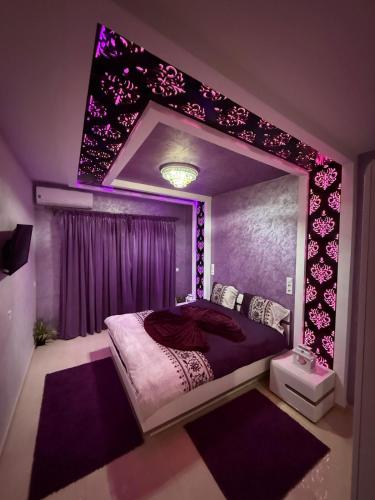 a bedroom with a bed with a large mirror at Ara Villa in Marrakech