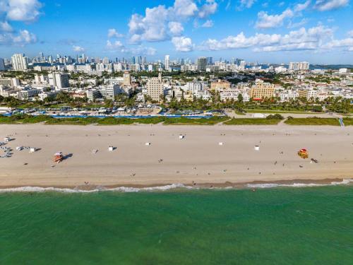an aerial view of a beach with a city in the background at Hotel Ocean in Miami Beach