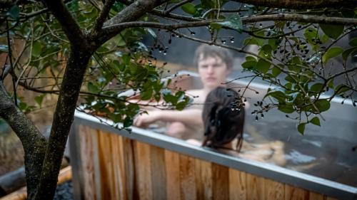 a man in a bathtub with a woman in it at RENEST in Kobe