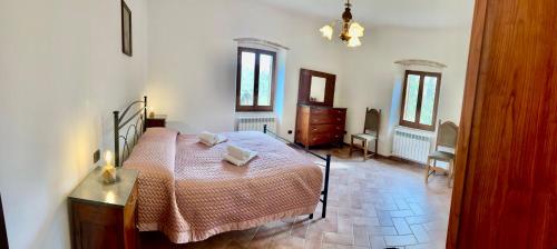 Ένα ή περισσότερα κρεβάτια σε δωμάτιο στο Casa Giuliani