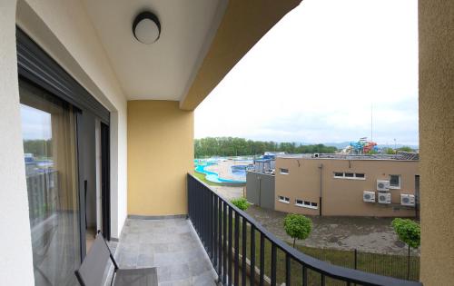a balcony with a view of a water park at Apartmani Central A11 & Free parking in Vrnjci