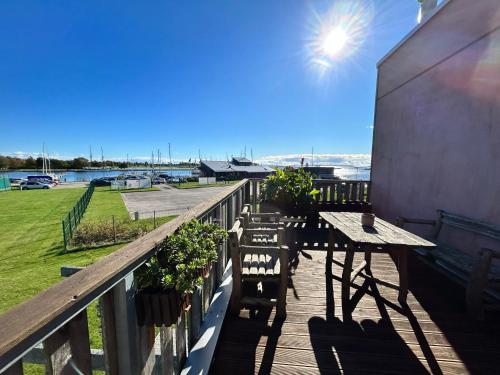 a balcony with a table and chairs and the ocean at Privat&near to GOspa in Kuressaare