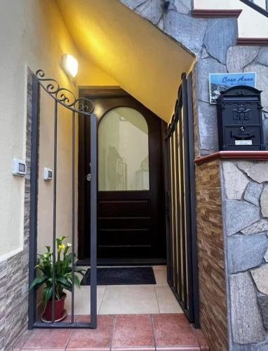an entrance to a house with a black door at casa anna in Vico Equense