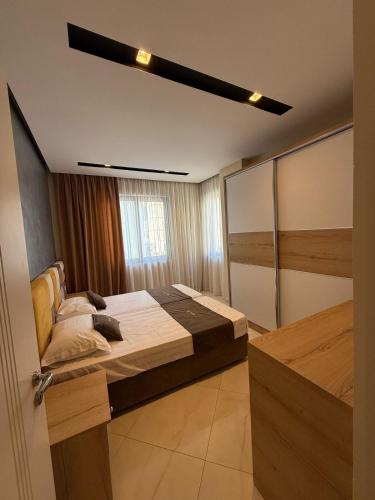 Postel nebo postele na pokoji v ubytování Nova Apartaments Qerret
