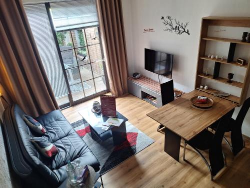 a living room with a couch and a table at Parva Domus in Xanten