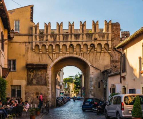 an archway over a street in an old building at CASA PANIERI in Rome