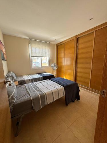a bedroom with a large bed in a room at villa casa Aymlo in Torre-Pacheco