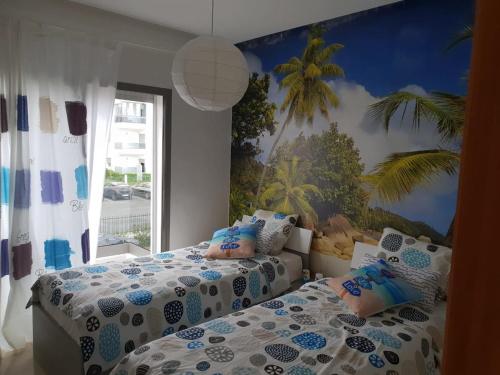 Giường trong phòng chung tại Villa Blanca