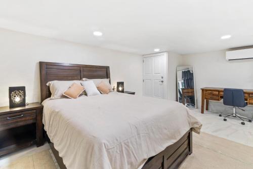 a bedroom with a large bed and a desk at Riverfront Suite in Washougal