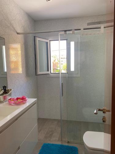 a bathroom with a shower and a toilet and a sink at House 50meters from the beach in Cunit