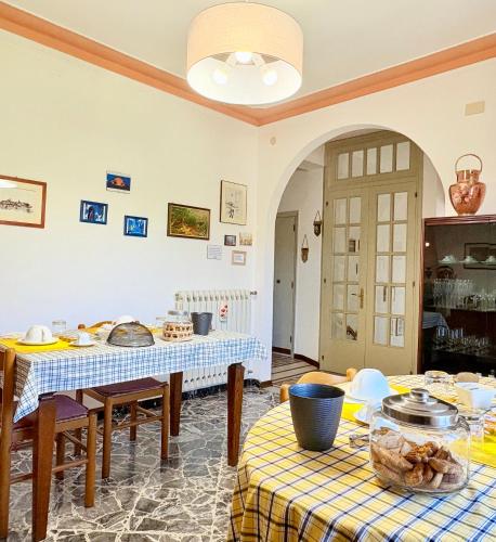 a living room with two tables with food on them at B&B Il Pozzo in Sinalunga