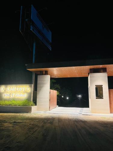 an entrance to a gas station at night at Coral Mahabs in Mahabalipuram