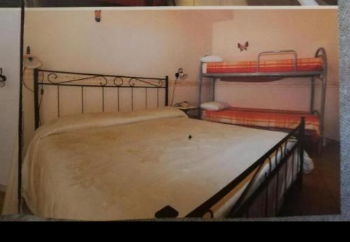 a bedroom with two bunk beds in a room at Cerasella in Cetara