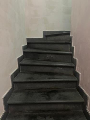 a set of concrete stairs in a building at Marieta Rooms in Sarzana