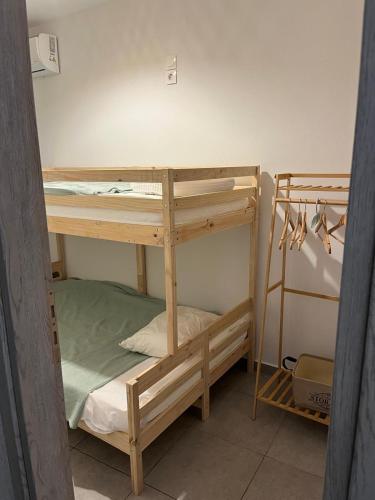 a couple of bunk beds in a room at G-House Skiathos in Skiathos