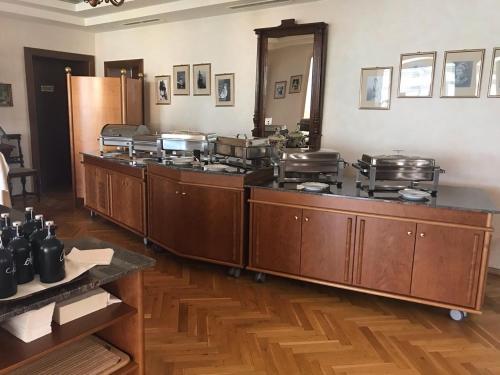 a kitchen with a bunch of pots and pans at Hotel Seehof in Sankt Georgen am Längsee