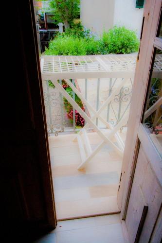 a view from an open door of a balcony at Old Style by the sea, roof terrace with pool and kitchen, Ladispoli in Ladispoli