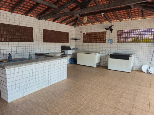a kitchen with two refrigerators in a room at Seu apê no Sal in Salinópolis
