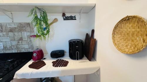 a kitchen counter withbrownies on a white table at Residencial Temporada Aracaju in Aracaju
