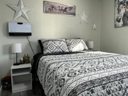 a bedroom with a bed with stars on the wall at Blue Mountain Retreat in Elgin
