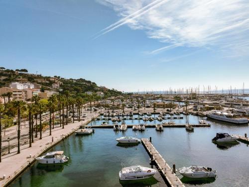 a group of boats docked in a harbor at Hotel Espadon bleu in Le Lavandou