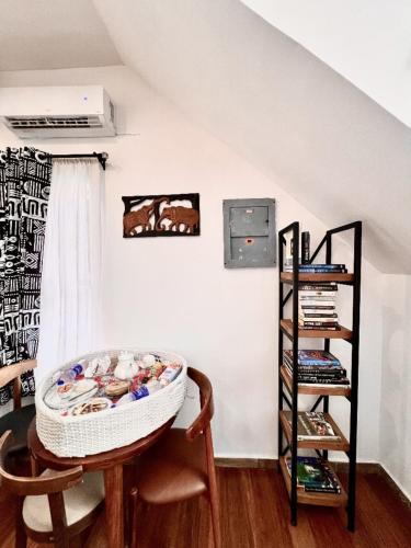 a room with a chair and a shelf at AVISTA Beach Resort Lekki Lagos in Lekki