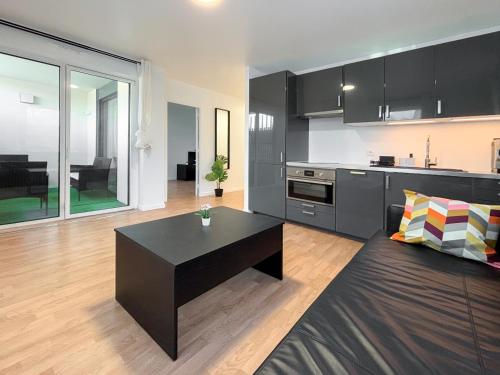 Appartement Hôtel proche Paris Stade de France, 5 minutes à pied de la gare et parking privé pour 1 à 4 personnes