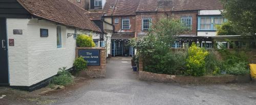 an empty street in a town with buildings at Bacon Arms, Newbury in Newbury