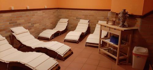 a row of chairs in a room with a brick wall at Sporthotel Dachstein West in Annaberg im Lammertal