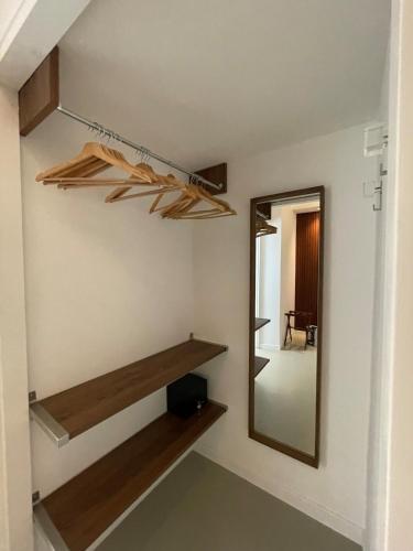 a dressing room with a mirror and a shelf at carpe diem sistina in Rome