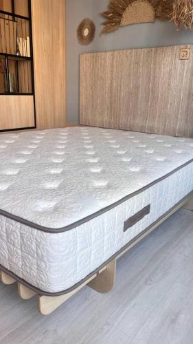 a mattress on a bed frame in a room at Boho apartment studio in Batumi