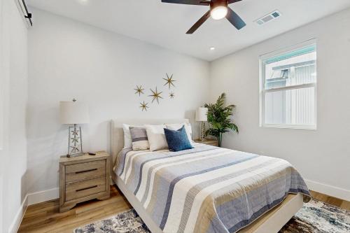 a bedroom with a bed and a ceiling fan at Blue Water Bluff in Kingsland