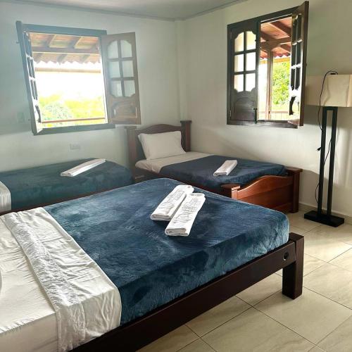 Ένα ή περισσότερα κρεβάτια σε δωμάτιο στο Hotel Campestre Villa Nazareth