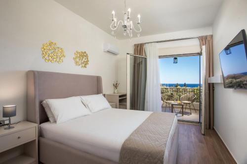 a bedroom with a bed and a view of the ocean at Aeon Rhodes - New Villa with private pool in Rhodes Town