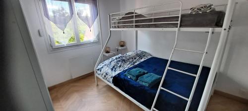 a bedroom with a bunk bed with a blue mattress at Villa 100m2 in Hyères