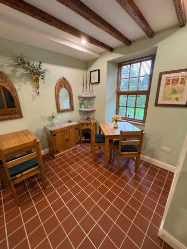a dining room with a table and chairs at Oakley Bed & Breakfast - Vegetarian, Vegan in Newcastle Emlyn