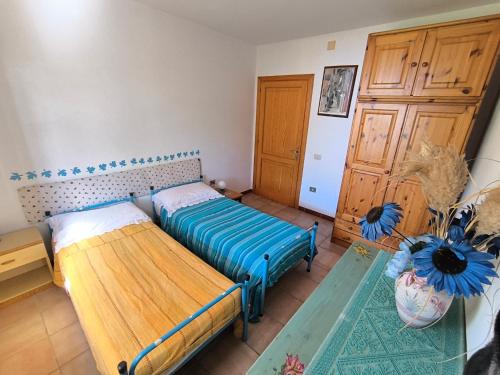 Postel nebo postele na pokoji v ubytování Casa Vacanze Bue Marino