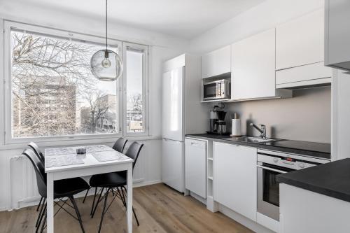 Η κουζίνα ή μικρή κουζίνα στο Marina Apartment in the Heart of Turku