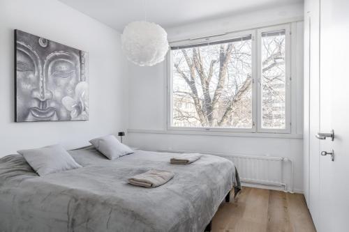 Ένα ή περισσότερα κρεβάτια σε δωμάτιο στο Marina Apartment in the Heart of Turku