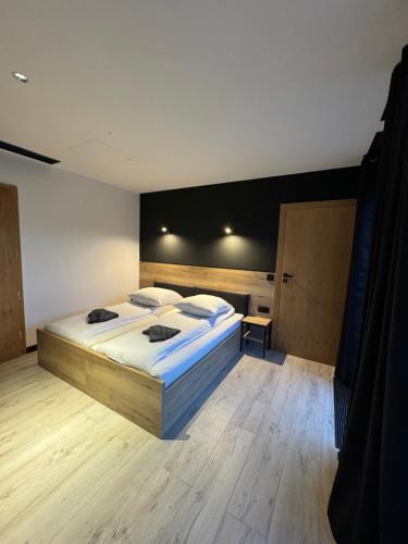 a bedroom with a large bed in a room at Aparthotel Łódź 55 Piotrkowska in Łódź