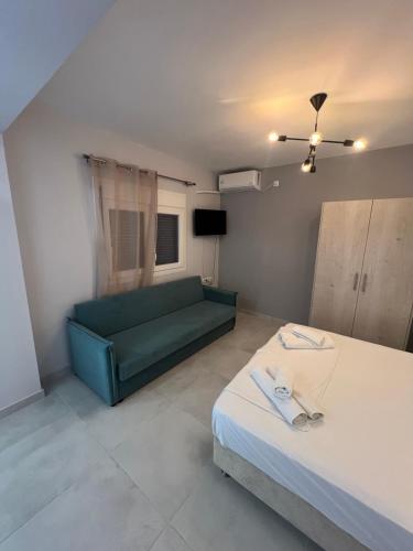a living room with two beds and a couch at Tillo apartments in Sivota