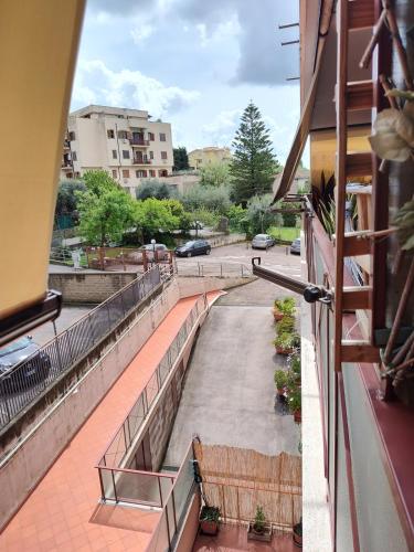 a balcony with a bench and a street at CasaF - Appartamento con parcheggio privato in Velletri