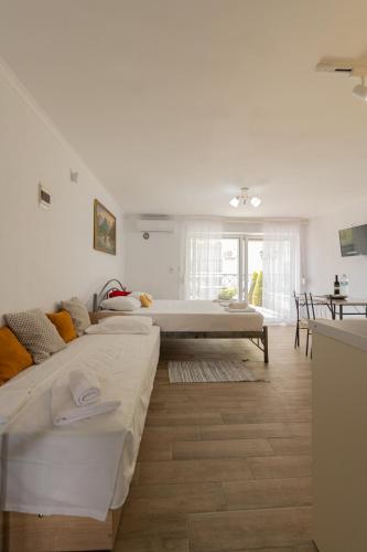 Ένα ή περισσότερα κρεβάτια σε δωμάτιο στο Toli apartments