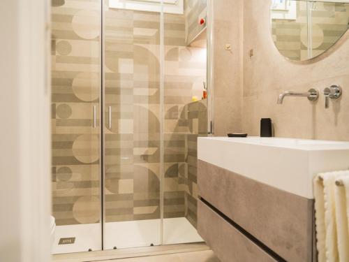 a bathroom with a shower and a sink at Pellarhome Quality Guest House in Pellaro