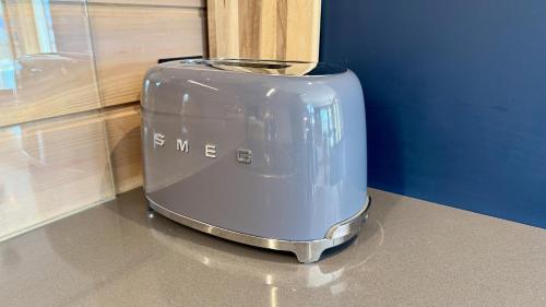 a toaster sitting on top of a counter at Spacious, modern cabin Ramberg Lofoten in Ramberg