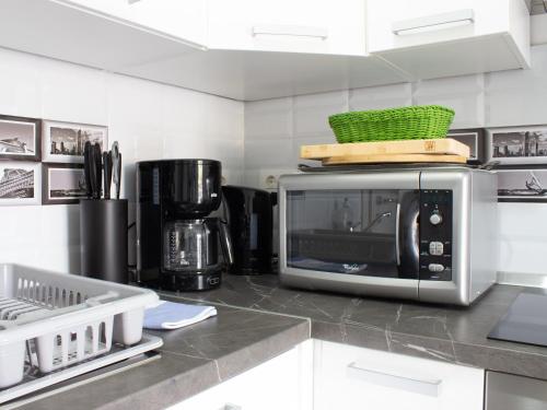Kuchyň nebo kuchyňský kout v ubytování Apartmani RiA