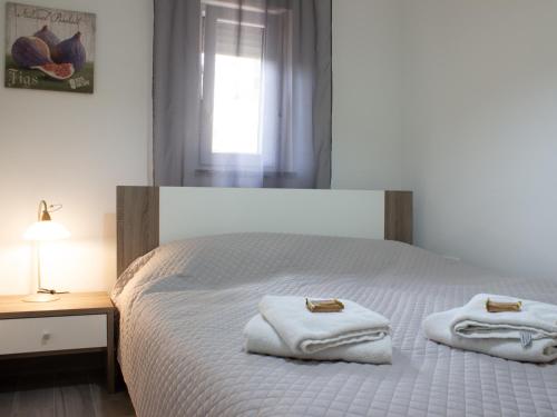 Postel nebo postele na pokoji v ubytování Apartmani RiA